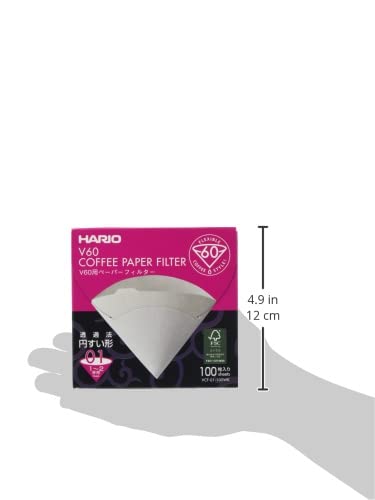 Hario V60 Size01 white filters spread on table ready for brew.