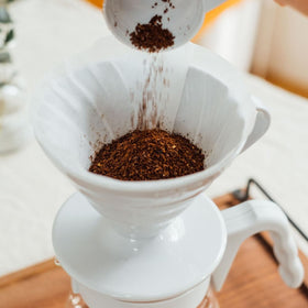 Hario V60 filters included for quick setup and fresh coffee.