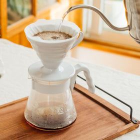Hario V60 measuring scoop for precise coffee dosing.