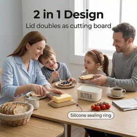 Hasense white porcelain butter dish on a clean kitchen countertop for easy access.