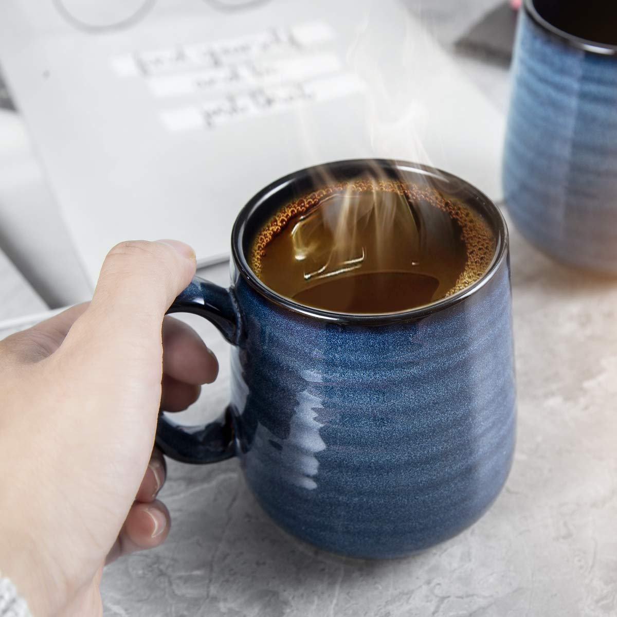 Hasense porcelain mugs on a desk setup for morning beverages