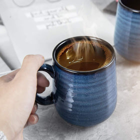 Hasense porcelain mugs on a desk setup for morning beverages
