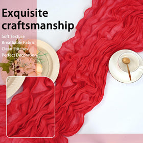 HASJOIN arch decoration with flowing red runners for a woodland-style party