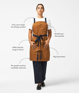 Hedley Bennett Crossback Apron features double lap pockets for organization.