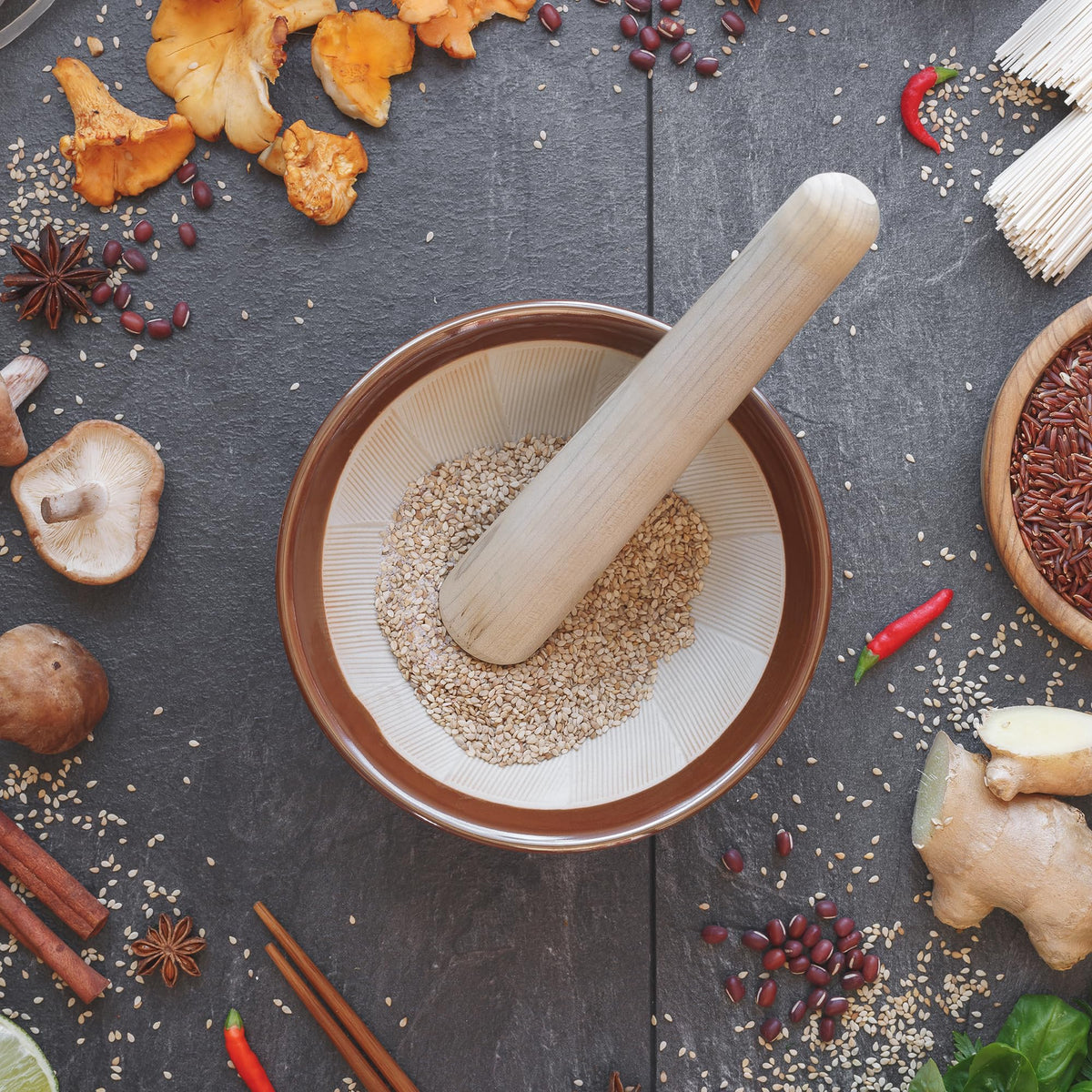 Helen’s Asian Kitchen wooden Surikogi pestle fits the bowl for steady crushing.