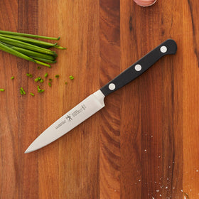Henckels Classic center tip paring knife in use for precise fruit prep
