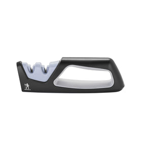 Henckels handheld sharpener with a coarse ceramic stage for quick edge refresh.