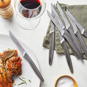 Henckels razor-sharp steak knife set 8 on display for effortless table-side cutting.