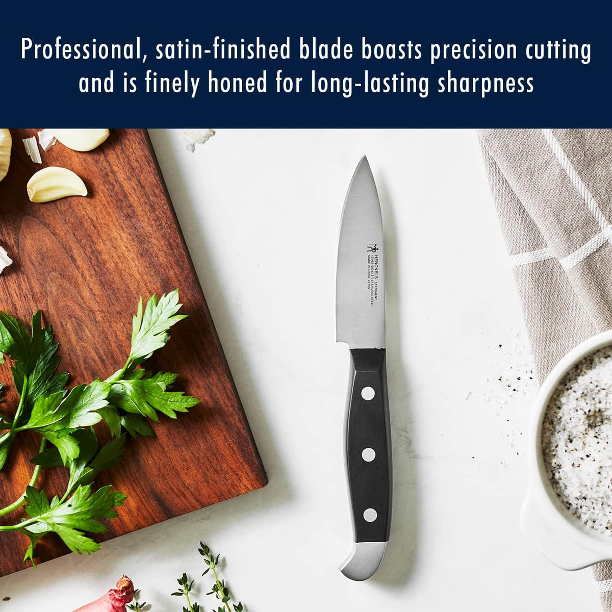 HENCKELS Statement 3-inch paring knife for detailed peeling and trimming.