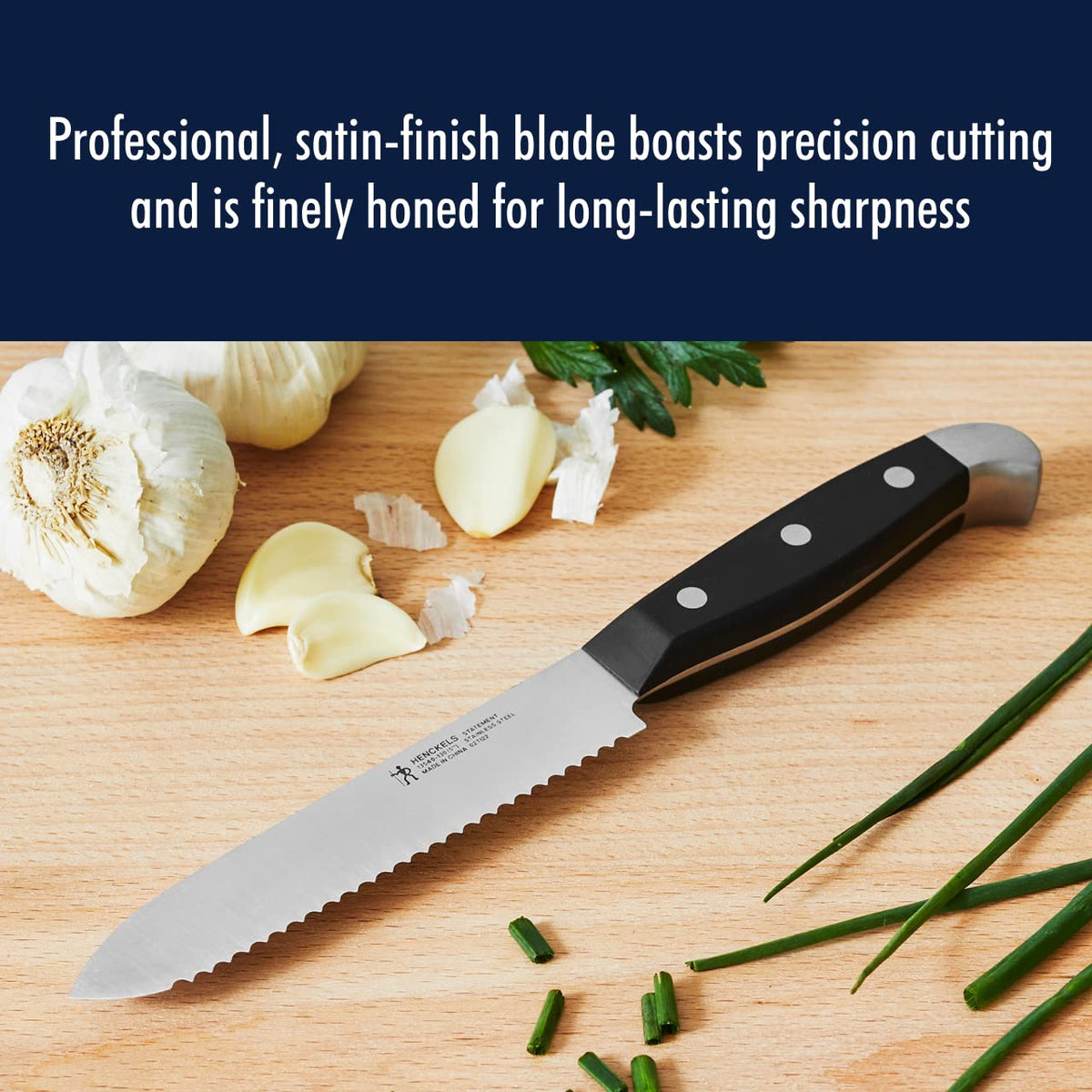Henckels Statement 5 inch serrated knife lightweight for comfortable prep.