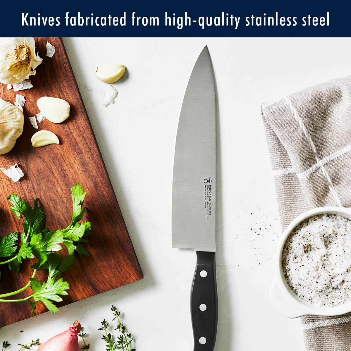 HENCKELS Statement 5-inch serrated utility knife handles soft interiors and firm exteriors with control.