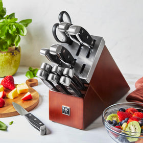Henckels Statement blades with ergonomic triple-rivet handles support comfortable kitchen work.