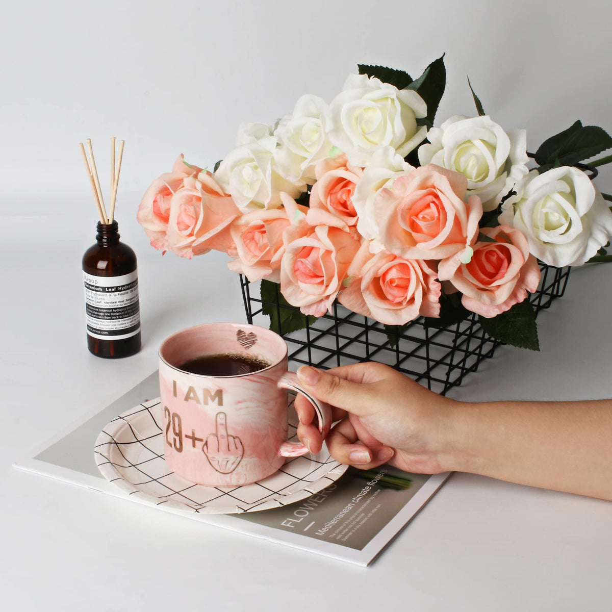 Hendson pink mug on a desk, ideal for morning breaks at work