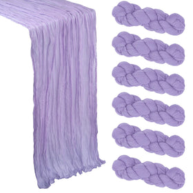 Heneger 6-pack lilac purple cheesecloth table runner on table showing 10ft length