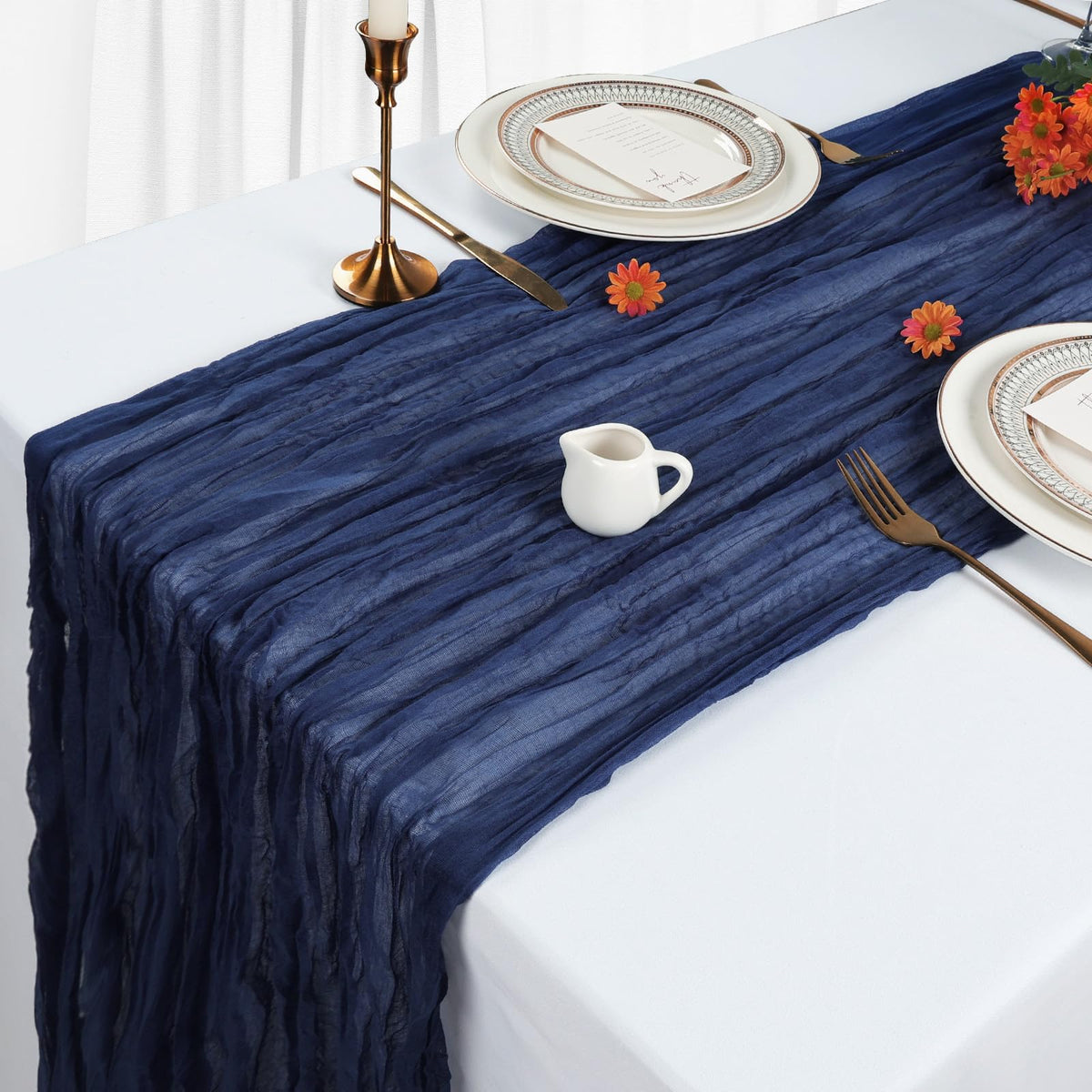 Heneger cheesecloth backdrop enhances soft, airy party atmosphere.