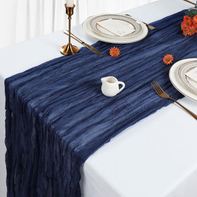 Heneger cheesecloth backdrop enhances soft, airy party atmosphere.