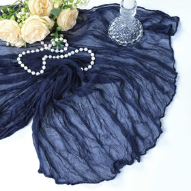 Heneger navy cheesecloth runner on staged table decor.
