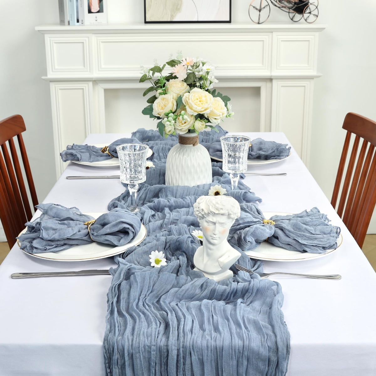 Heneger dusty blue cheesecloth backdrop draping for romantic ambiance.