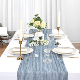 Heneger dusty blue table runner draped on table for elegant event styling.