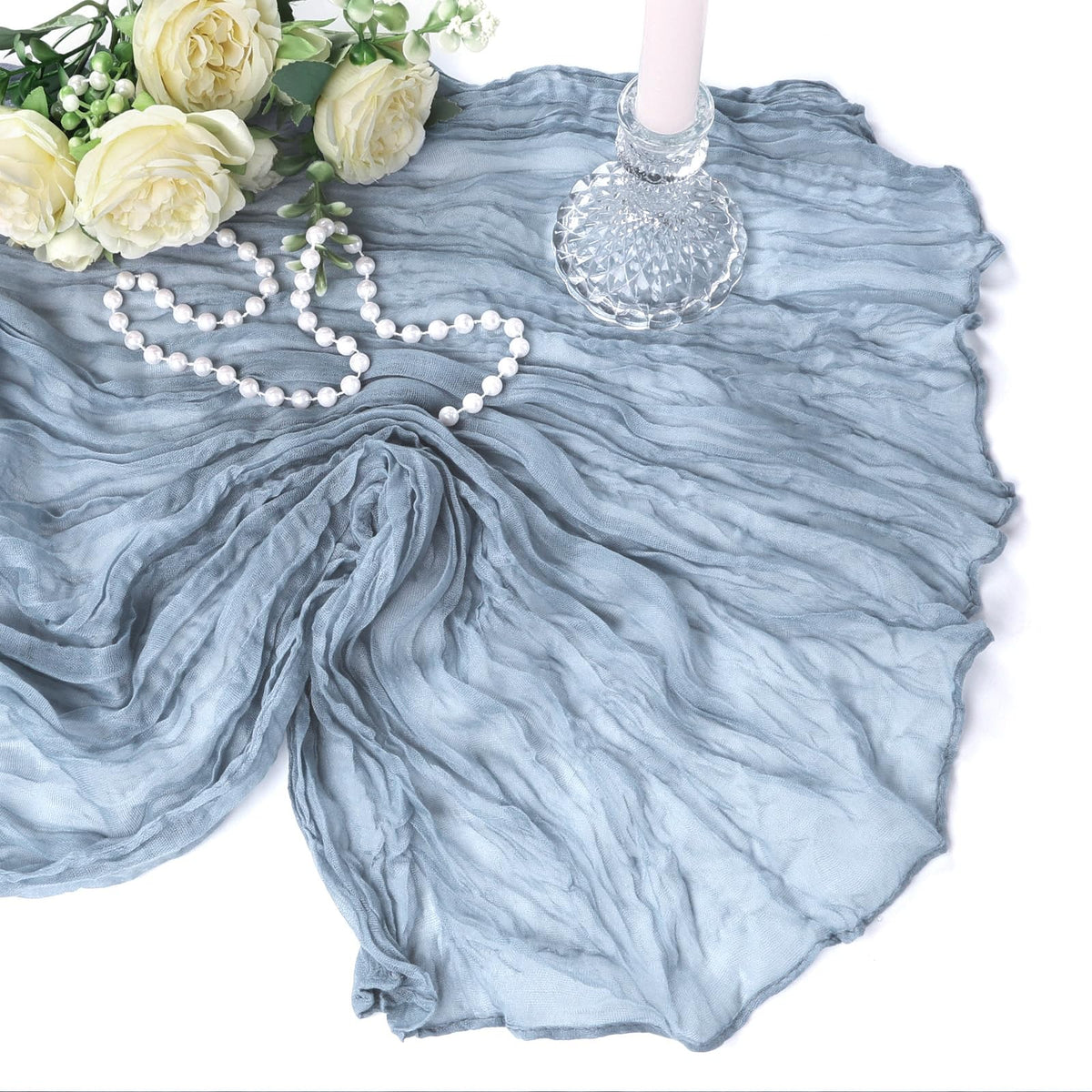 Heneger dusty blue table runner close-up shows wrinkle texture and soft touch.