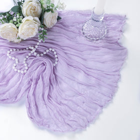 Heneger cheesecloth runner used as home decor on curtains and shelves