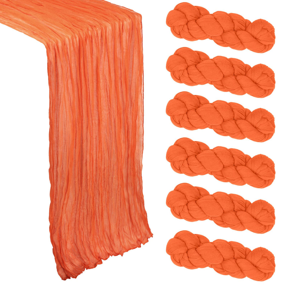 Heneger orange cheesecloth table runner closeup showing crinkled texture and rustic warmth