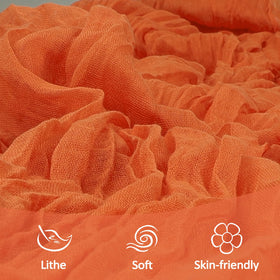 Backdrop draping idea using Heneger orange cheesecloth runner for party decor