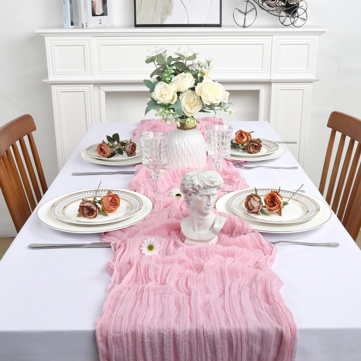 Heneger pink cheesecloth décor enhances party tables with soft color.