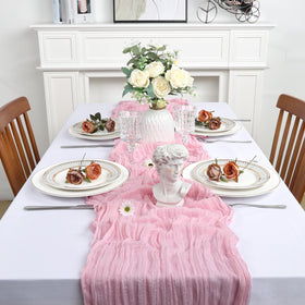 Heneger pink cheesecloth décor enhances party tables with soft color.