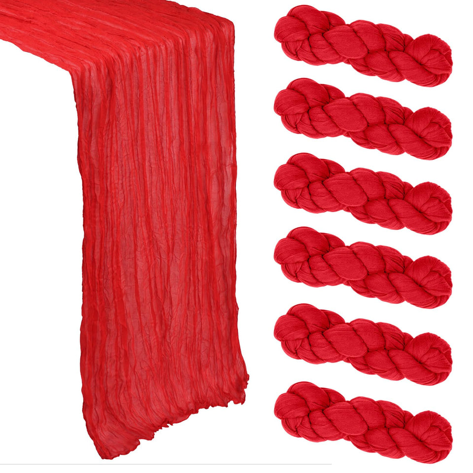 Heneger red table runner draped on a table for elegant event décor.