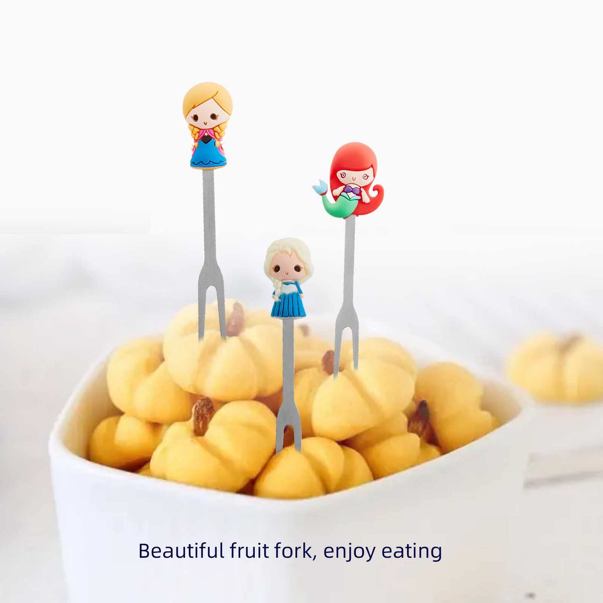 HENWAFX decorative display featuring fruit forks on a tray.