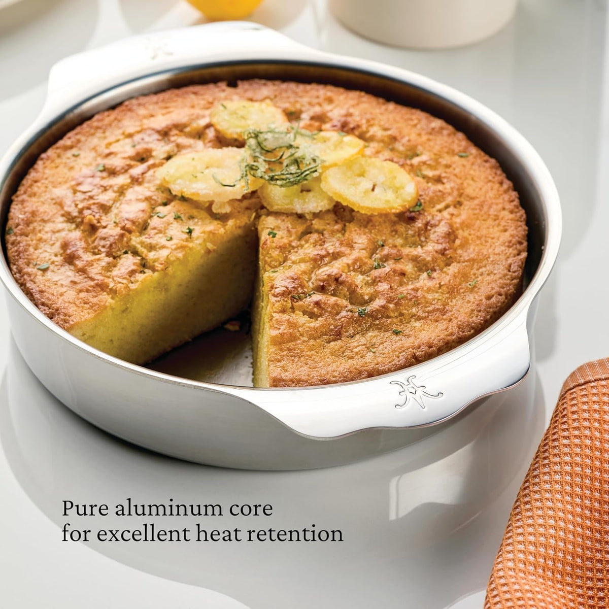 Hestan Provisions OvenBond Round Baker wide handles enable secure grip with oven mitts.