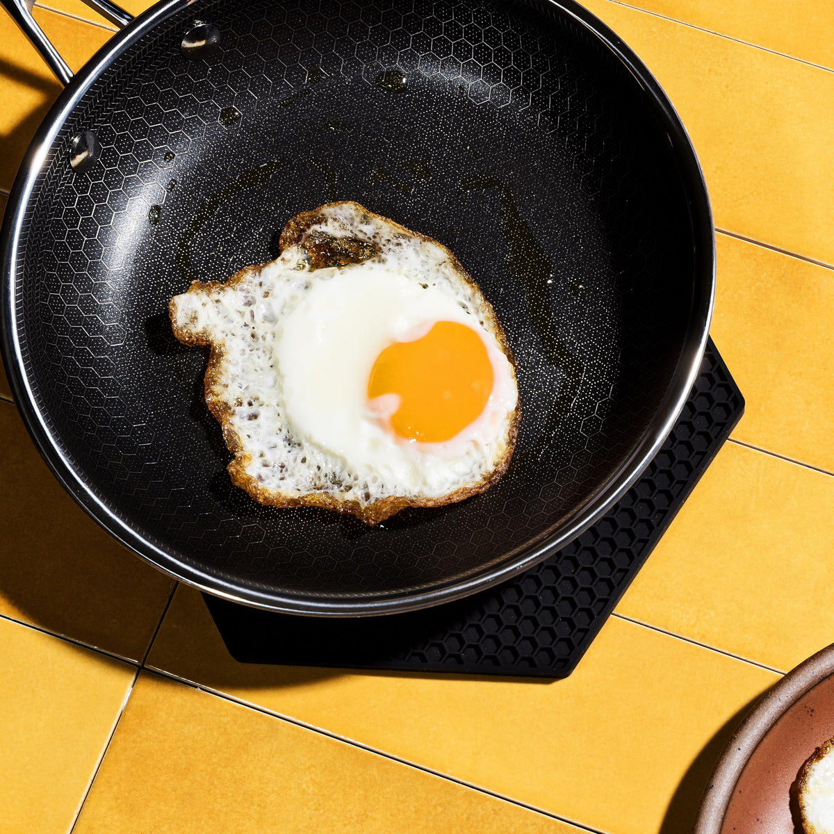 HexClad easy-clean silicone trivet wipes clean with a damp cloth