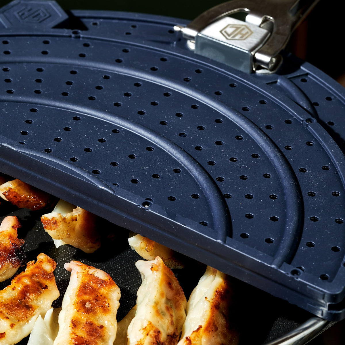 HexClad grease splatter screen fits 10- and 12-inch pans and woks