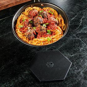 HexClad heat-resistant trivet withstands high temperatures without damage