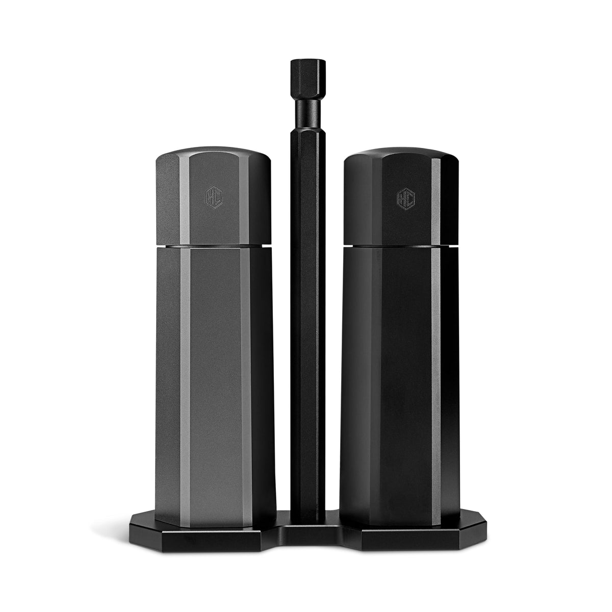 HexClad HexMill table-top salt and pepper grinder set on a dining table for easy seasoning.