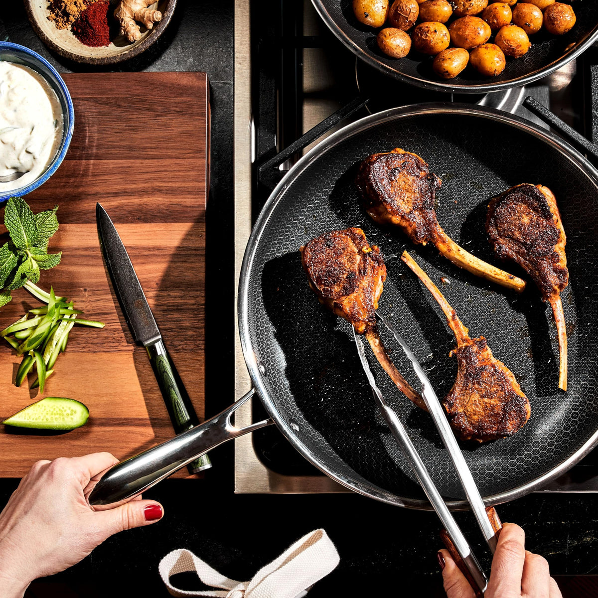 HexClad Hybrid 12-inch pan sizzling vegetables for a quick sear