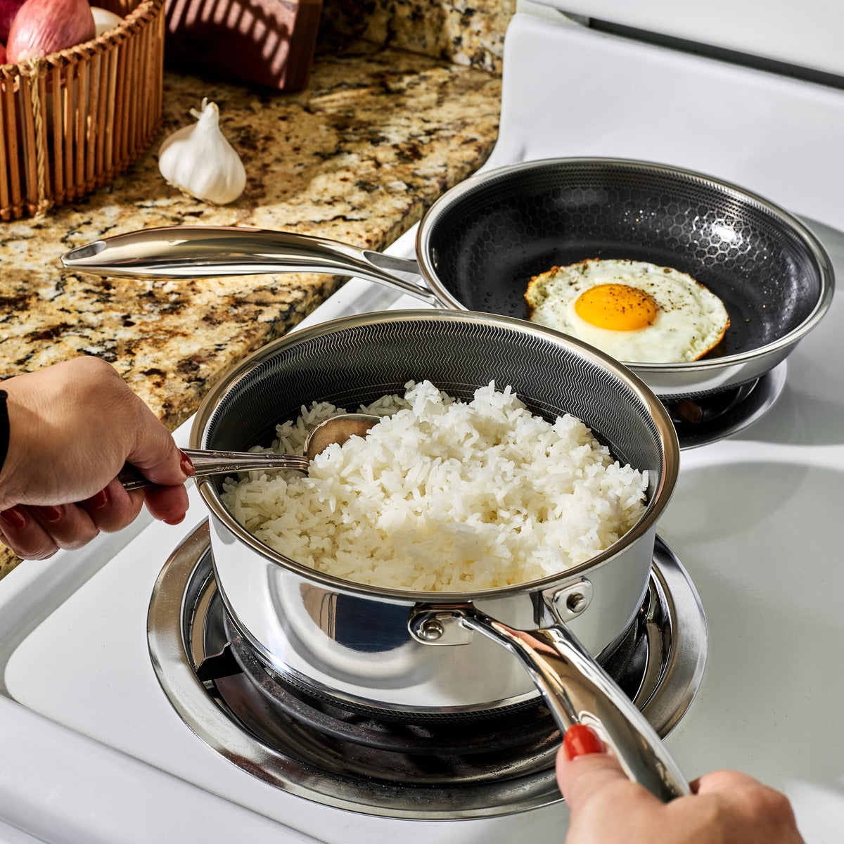 HexClad Hybrid 2-Quart Saucepan with lid on, perfect for simmering grains.