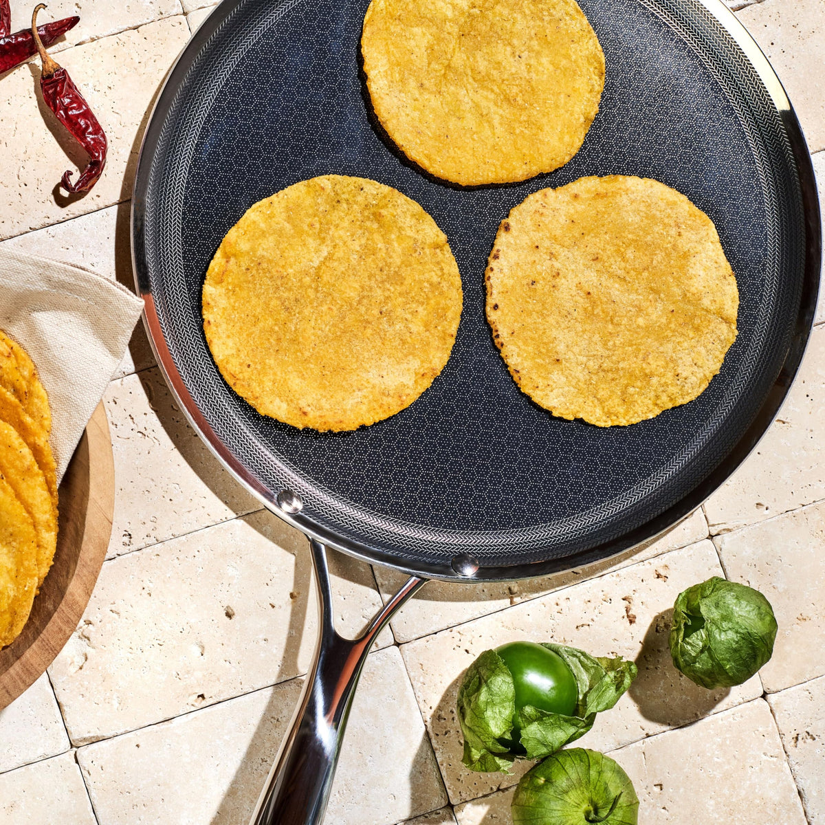 HexClad Hybrid Griddle stay-cool handle reduces heat exposure.