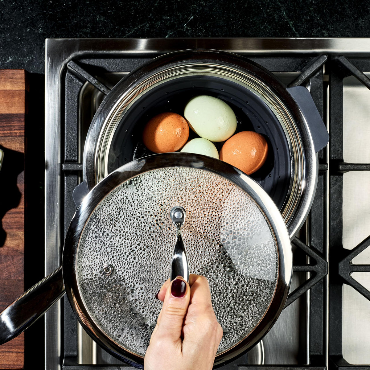 HexClad steamer basket features non-slip handles for safe lifting.