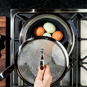 HexClad steamer basket features non-slip handles for safe lifting.