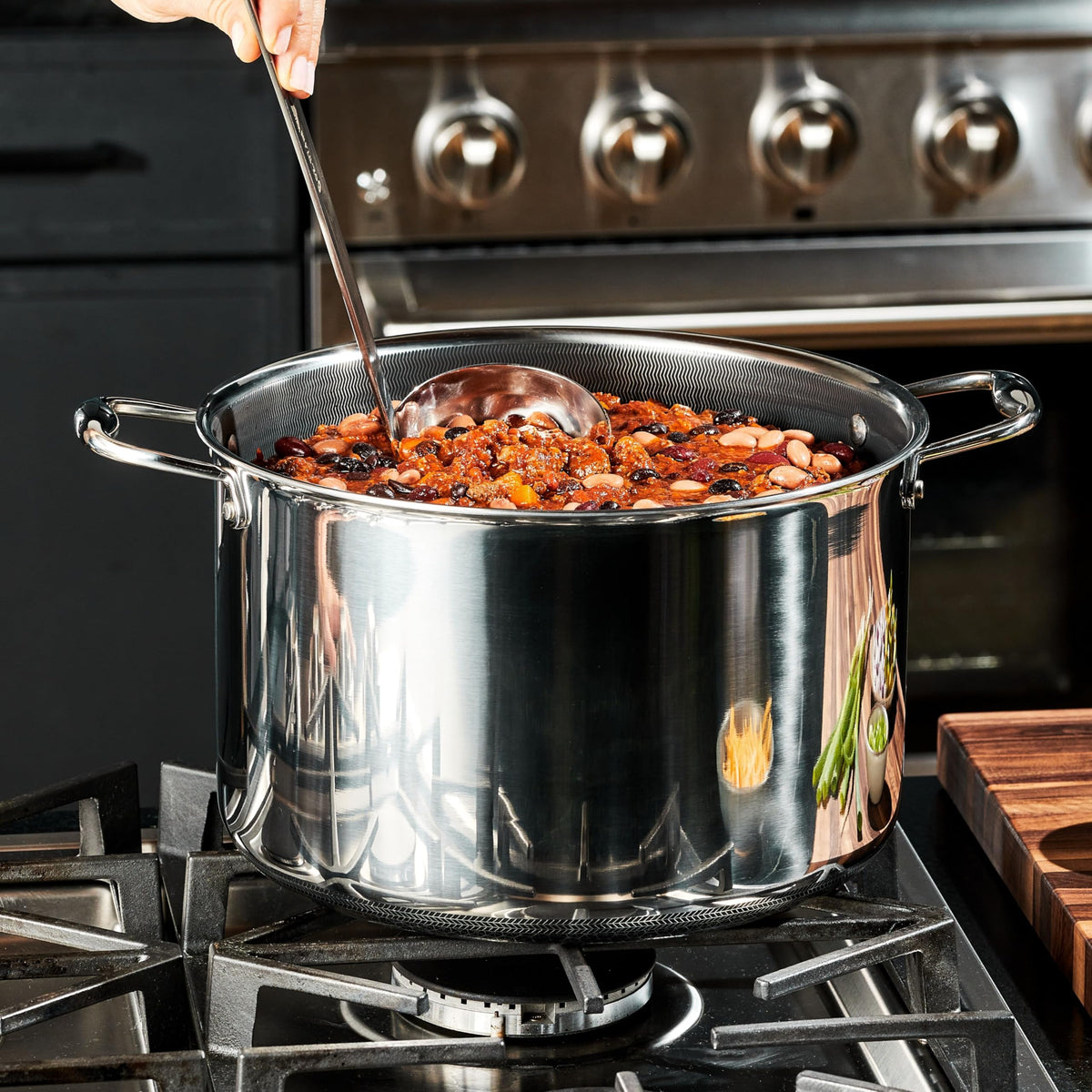 HexClad stovetop-compatible stockpot with metal utensil-safe surface for versatile cooking.