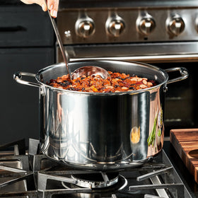 HexClad stovetop-compatible stockpot with metal utensil-safe surface for versatile cooking.