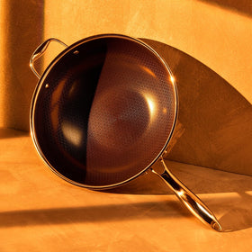 HexClad wok showing a stay-cool handle for safe tossing.
