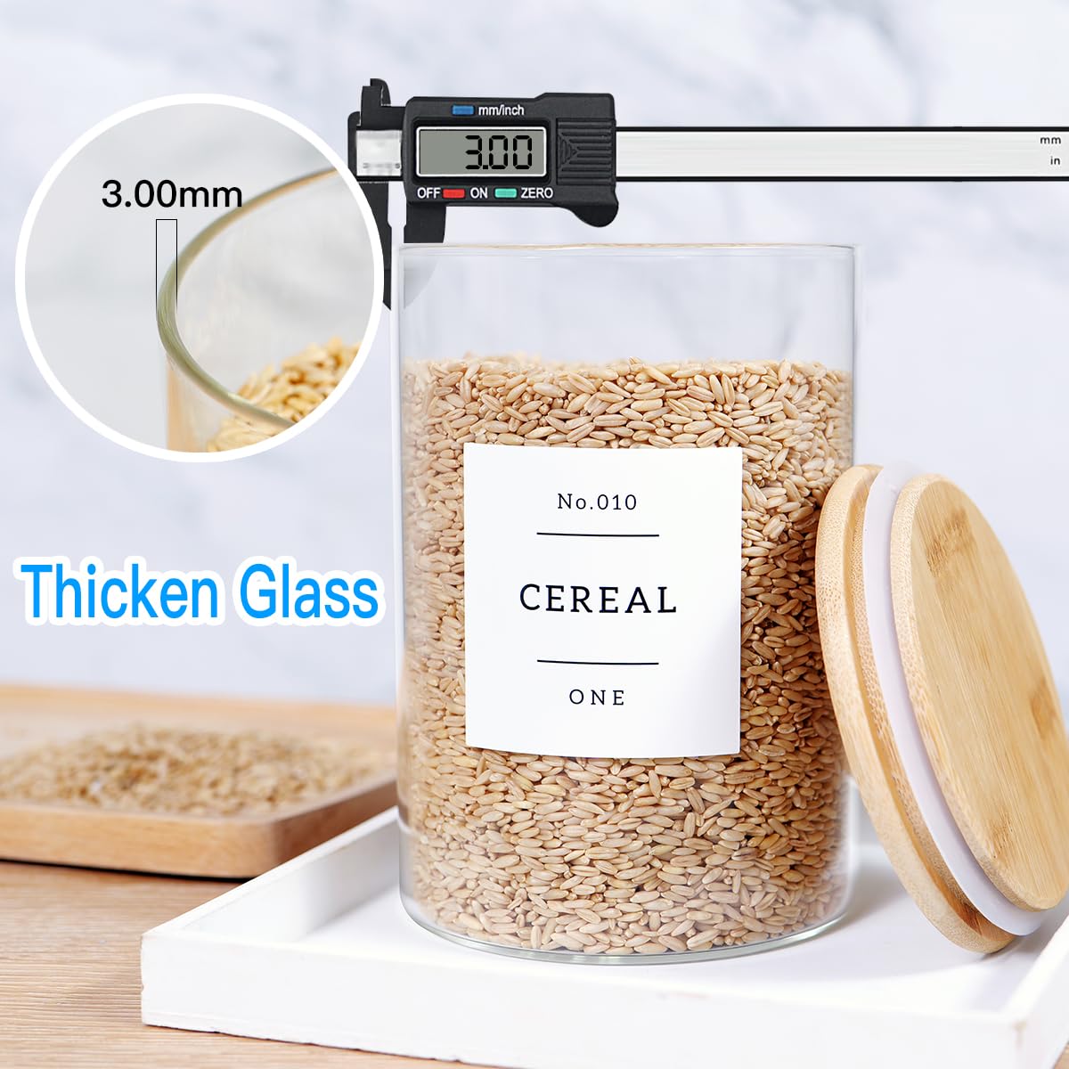HHMJSM minimalist kitchen storage with clear glass canisters.