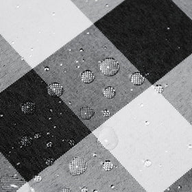 Hiasan checkered round tablecloth waterproof coating protects surfaces during meals.
