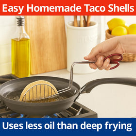 HIC Kitchen Taco Shell Tongs in use while frying on the stove for efficient shell prep.
