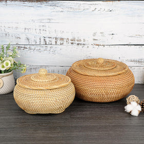 Hipiwe round rattan basket with lid on entryway table organizing keys.