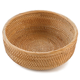 Hitomen round bread basket in natural rattan for kitchen serving and organization.