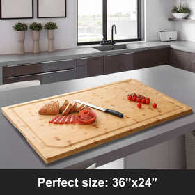 HIWARE bamboo board with juice grooves for mess-free liquid containment.